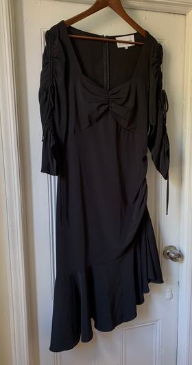 Black dress with ruching and ruffle hem